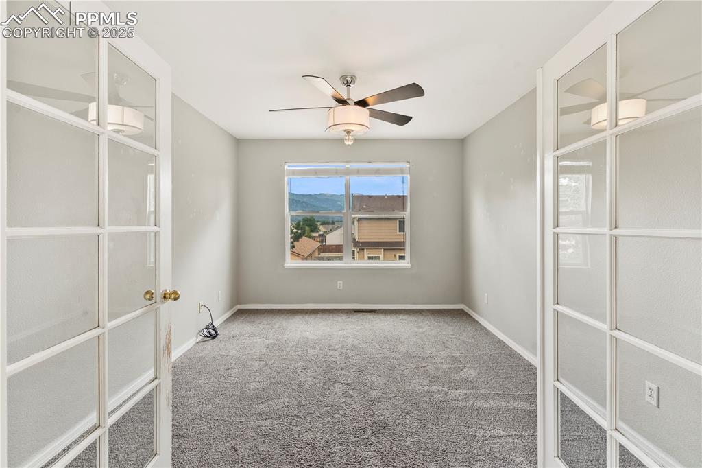 3320 Tail Spin Drive Colorado Springs, CO 80916 - Photo 10 of 28 a view of an empty room with a window