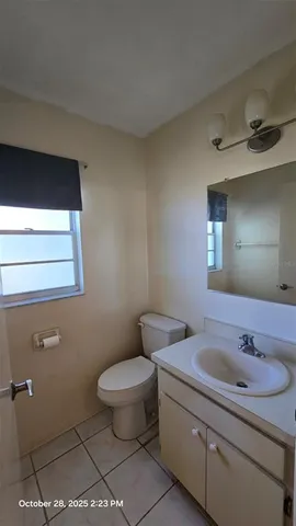 a view of an empty room and a window