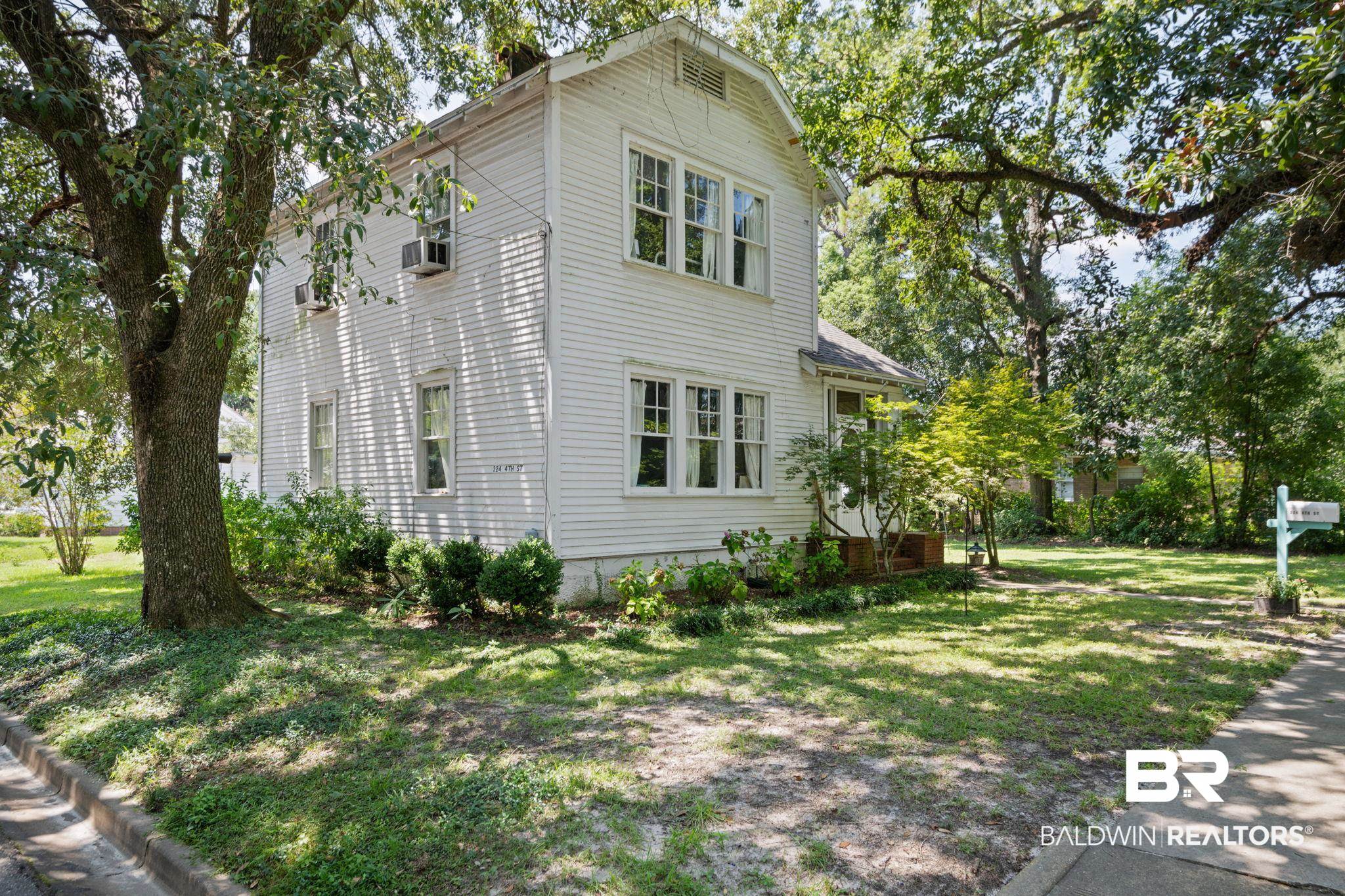 324 4th Street Mobile, AL 36611 - Photo 5 of 28 View of property exterior featuring a lawn
