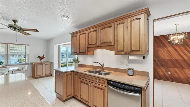 a kitchen with a stove a sink and a refrigerator