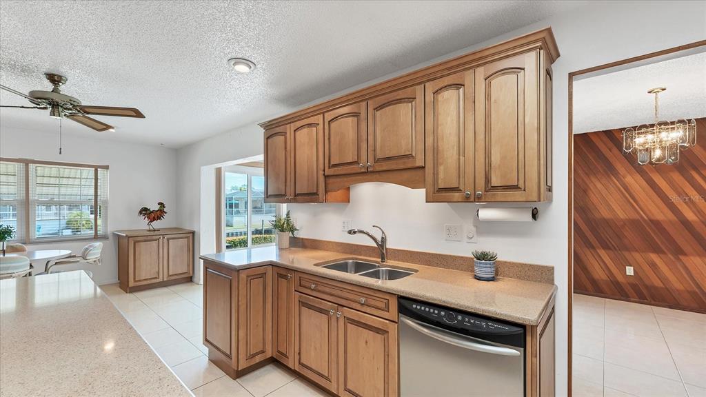 4515 Mangrove Point Road Bradenton, FL 34210 - Photo 17 of 59 a kitchen with a sink stove and cabinets