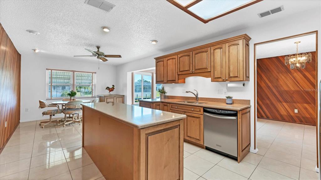 4515 Mangrove Point Road Bradenton, FL 34210 - Photo 18 of 59 a kitchen with a stove a sink and a refrigerator