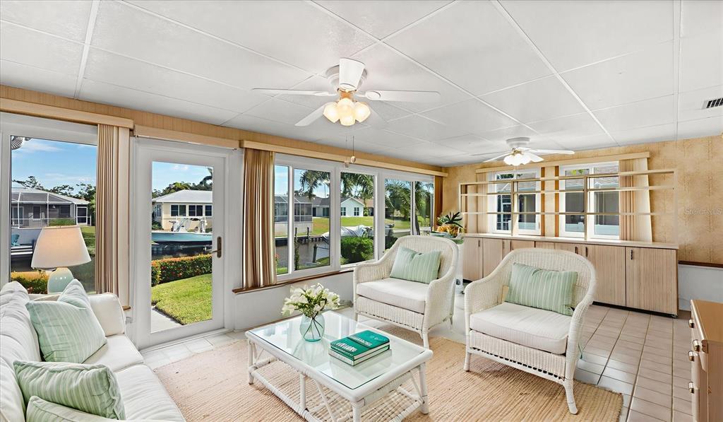 4515 Mangrove Point Road Bradenton, FL 34210 - Photo 31 of 59 a living room with furniture and a large window