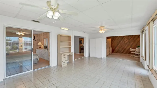 a view of room with window and ceiling fan