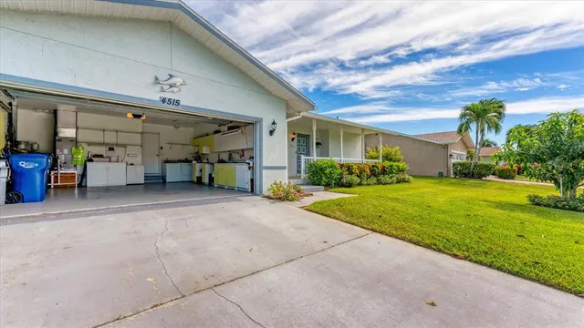 a view of a house with pool and garden