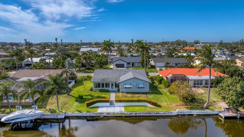 4515 Mangrove Point Road Bradenton, FL 34210 - Photo 40 of 59 an aerial view of residential houses with outdoor space and swimming pool
