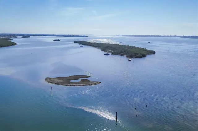 a view of a chairs and table in the balcony