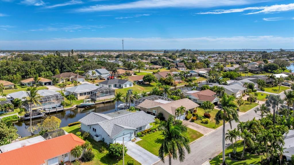 4515 Mangrove Point Road Bradenton, FL 34210 - Photo 5 of 59 an aerial view of a city with lots of residential buildings and ocean view