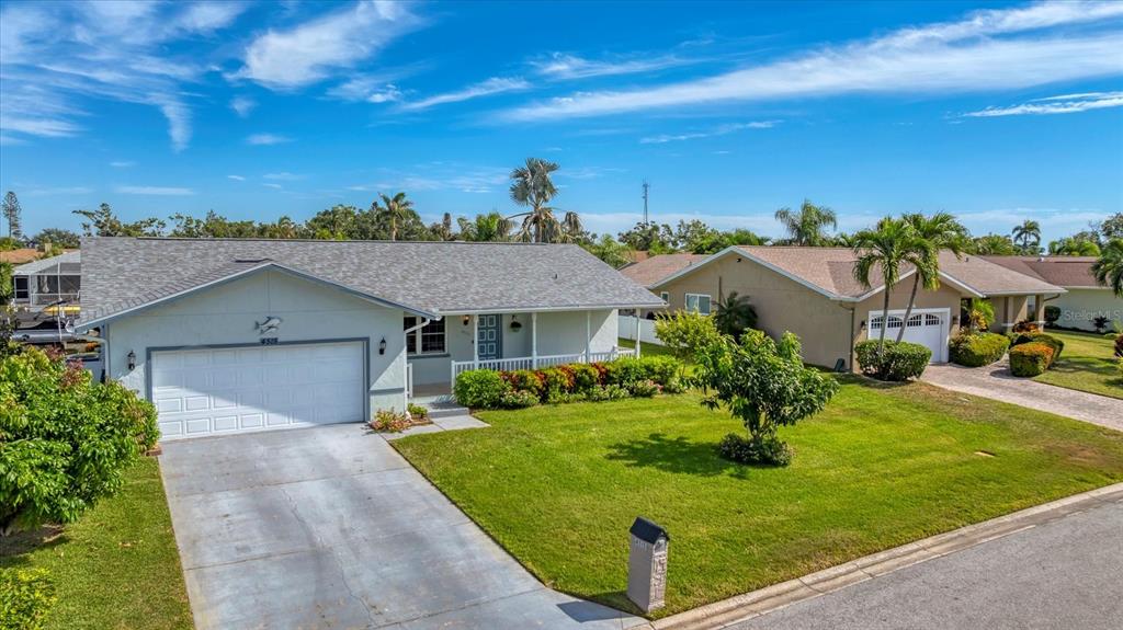 4515 Mangrove Point Road Bradenton, FL 34210 - Photo 6 of 59 front view of a house with a yard