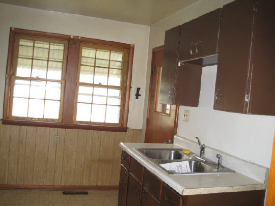 620 South 2nd Street Rochelle, IL 61068 - Photo 4 of 10 a bathroom with a sink and a large mirror