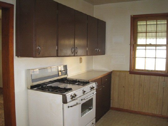 620 South 2nd Street Rochelle, IL 61068 - Photo 5 of 10 a kitchen with a stove and a cabinet