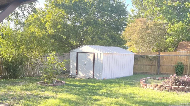 a view of backyard with green space