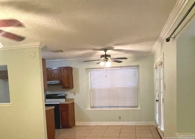 a view of a kitchen with a sink cabinets and a window