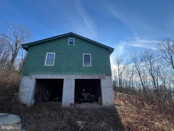a front view of a house with yard