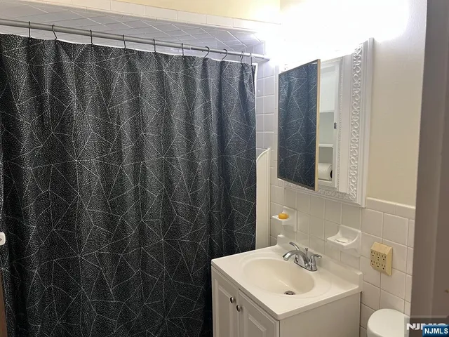 a bathroom with a sink and mirror