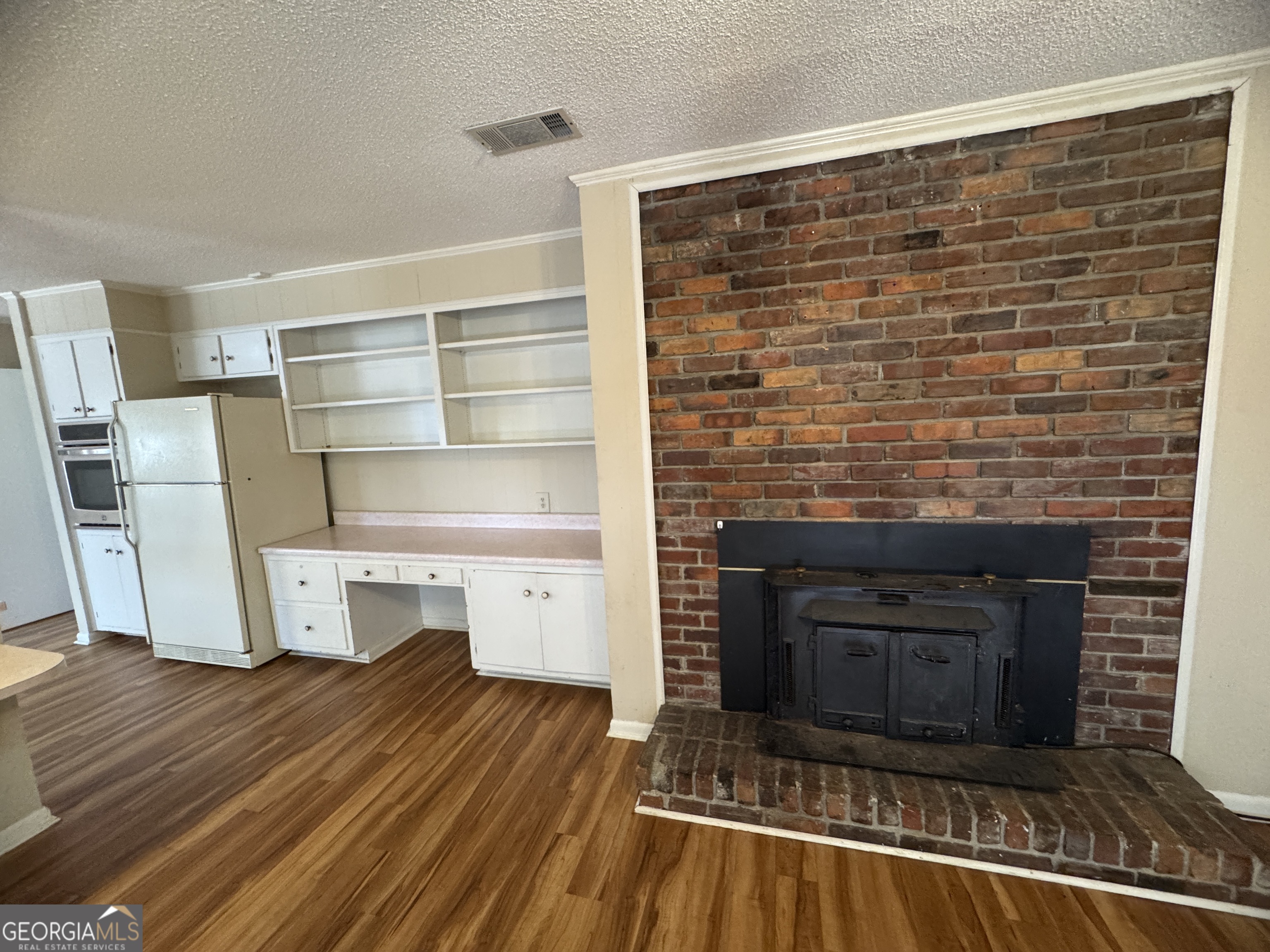 7290 Nevils Groveland Road Pembroke, GA 31321 - Photo 24 of 45 a view of a livingroom with furniture and a fireplace