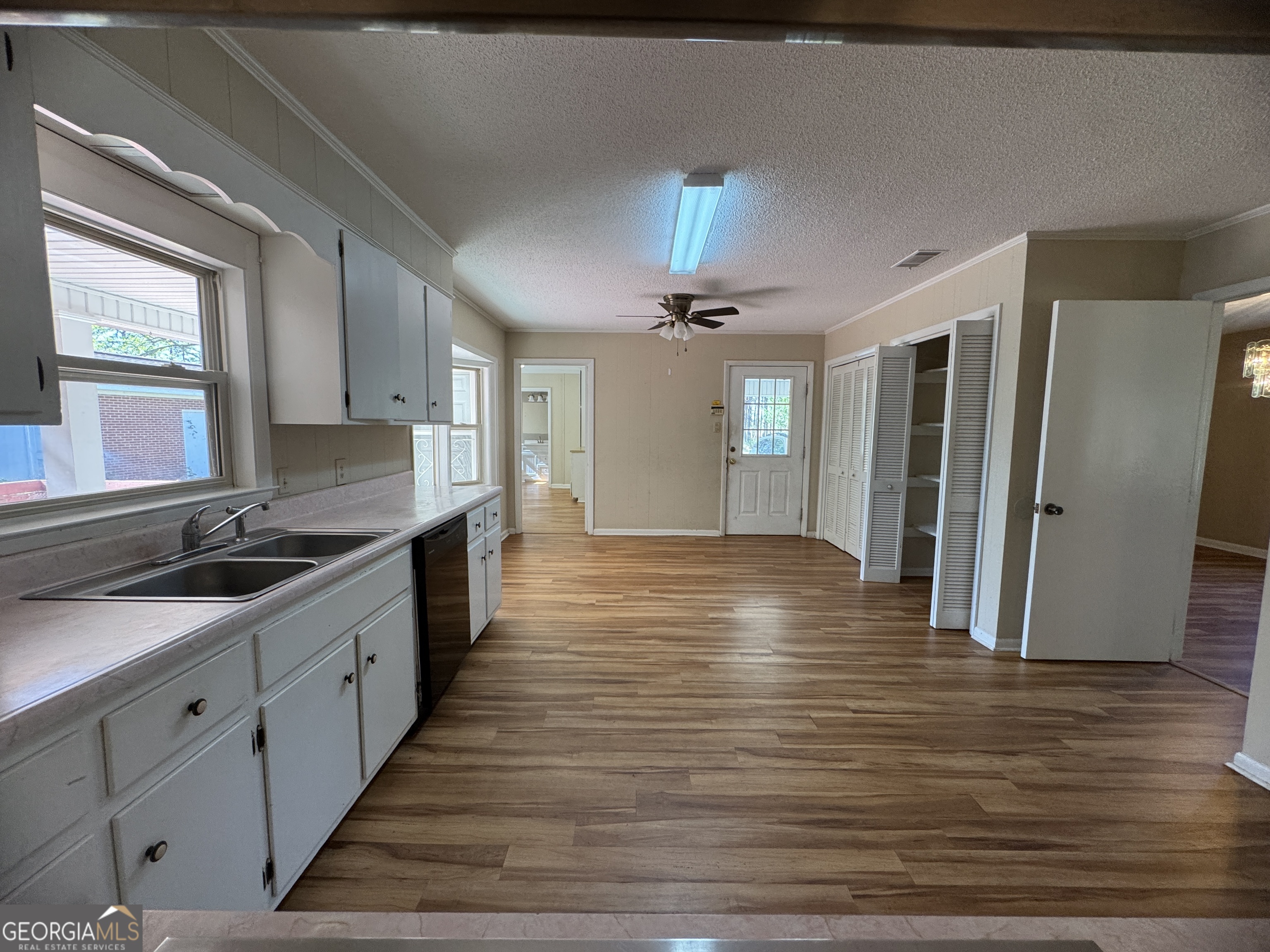 7290 Nevils Groveland Road Pembroke, GA 31321 - Photo 25 of 45 a large kitchen with stainless steel appliances granite countertop a lot of counter space and wooden floors