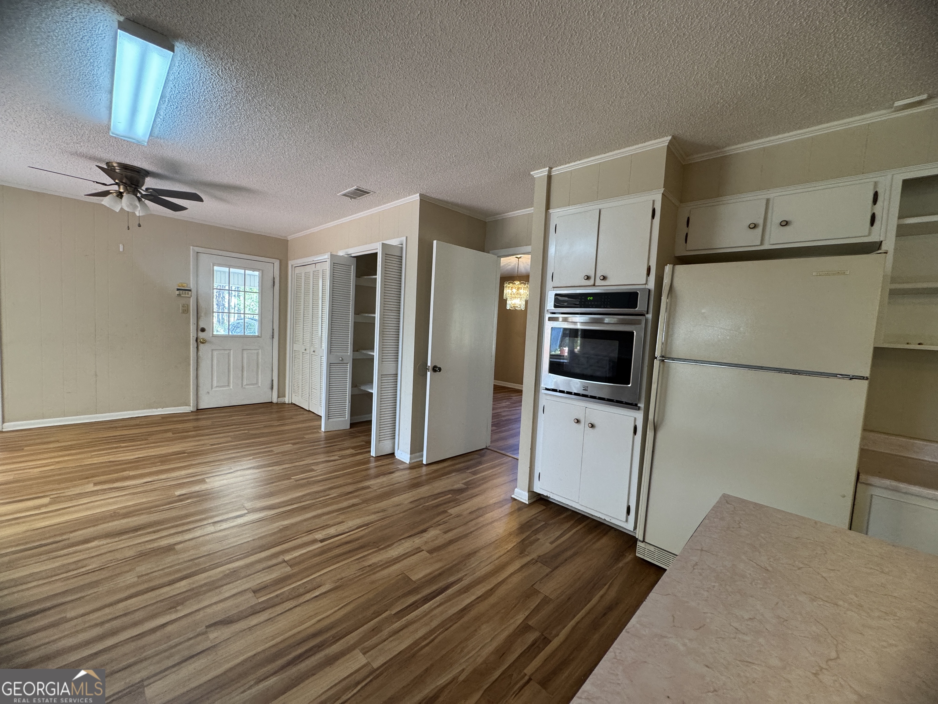 7290 Nevils Groveland Road Pembroke, GA 31321 - Photo 26 of 45 a view of kitchen with wooden floor and electronic appliances