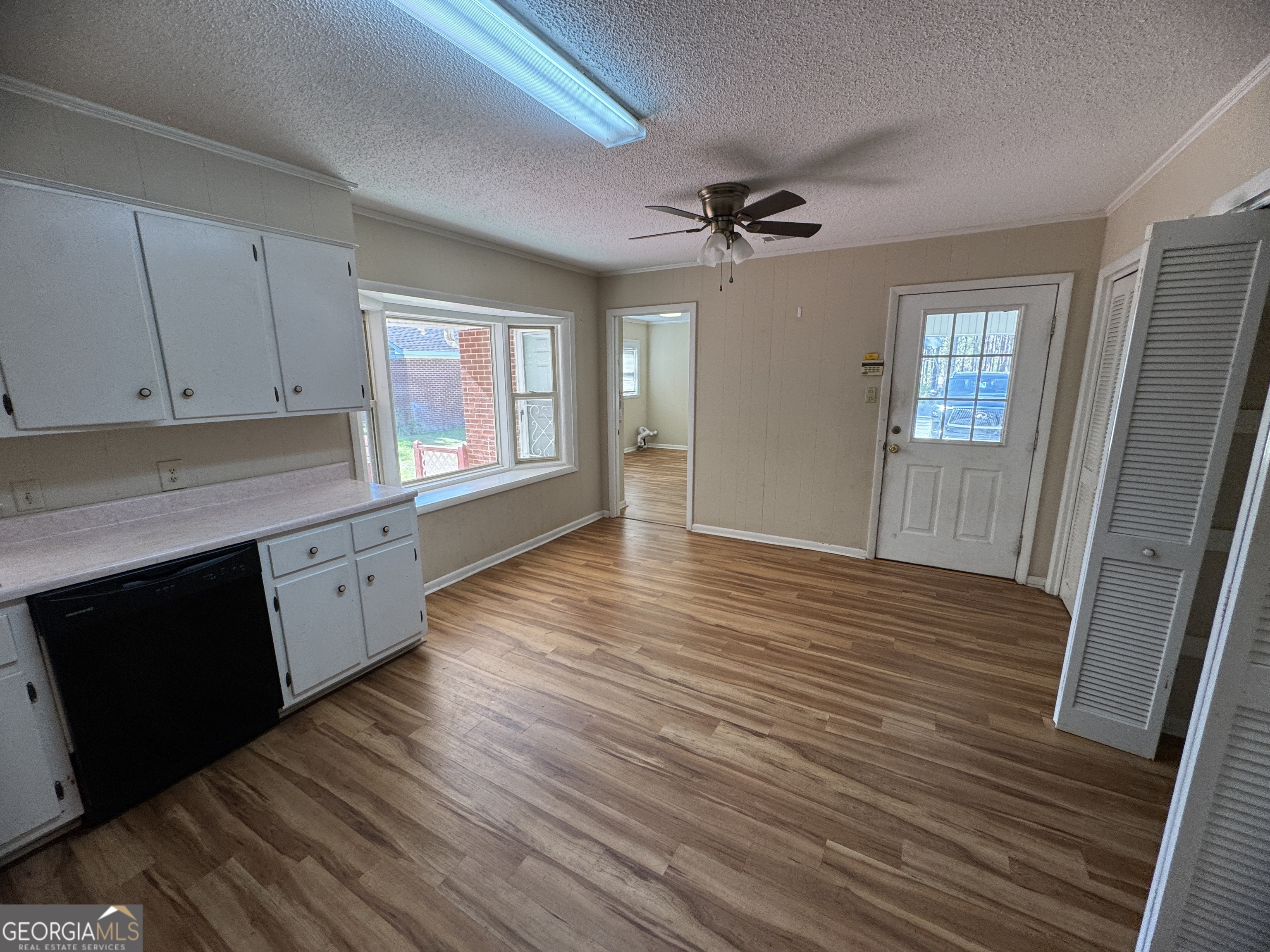 7290 Nevils Groveland Road Pembroke, GA 31321 - Photo 27 of 45 a view of a kitchen with wooden floor and a kitchen space