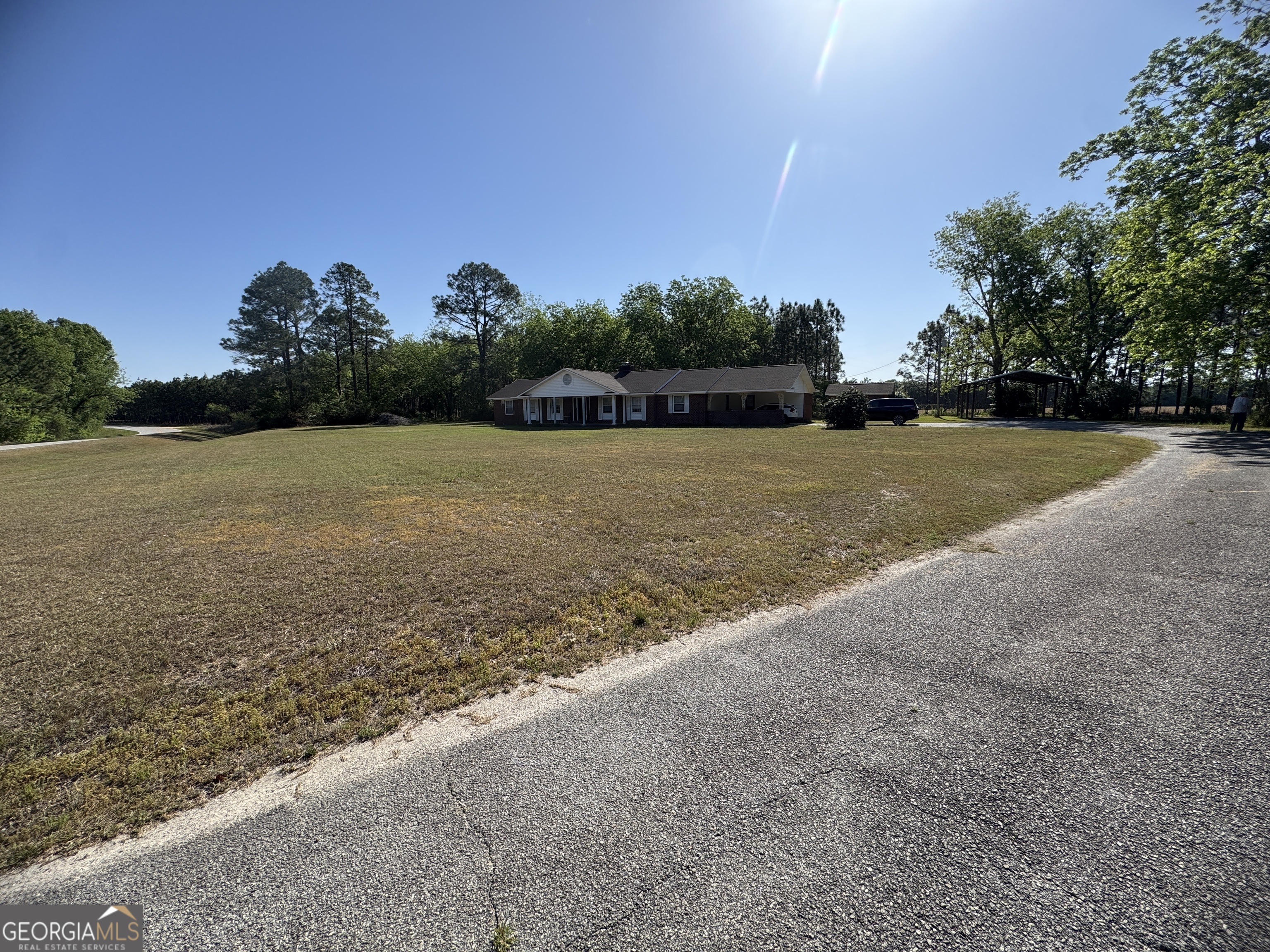 7290 Nevils Groveland Road Pembroke, GA 31321 - Photo 3 of 45 a view of a field with an trees