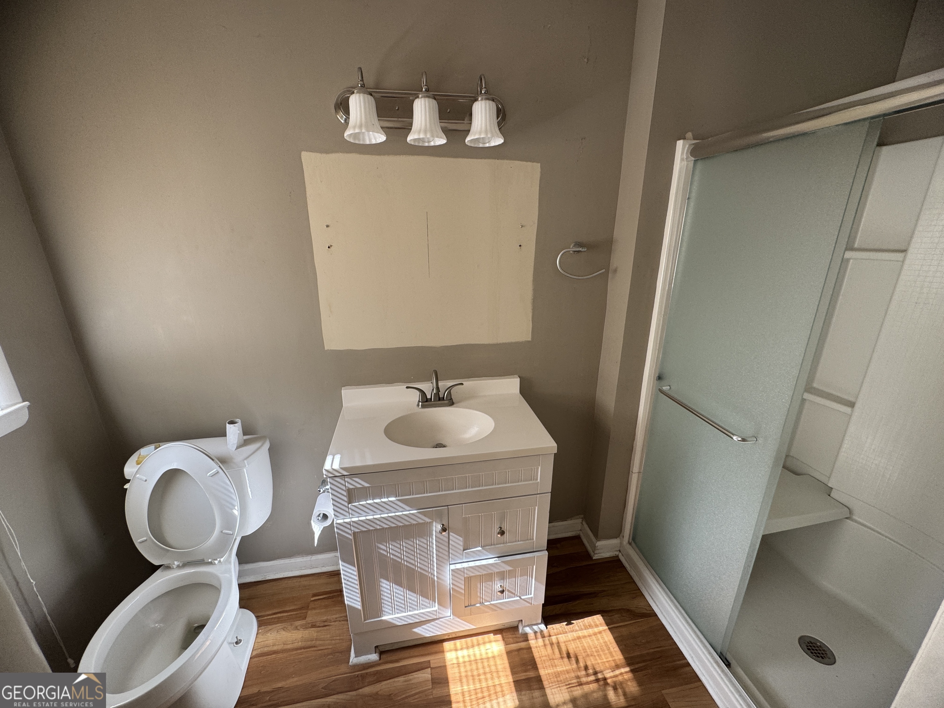 7290 Nevils Groveland Road Pembroke, GA 31321 - Photo 32 of 45 a bathroom with a sink and a mirror