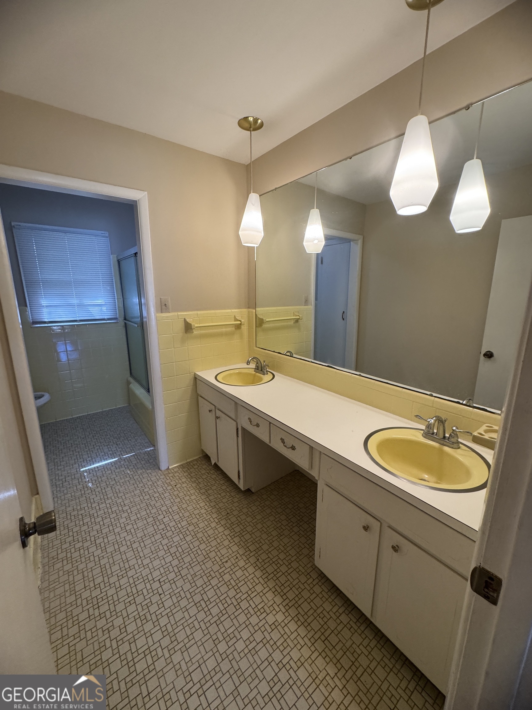 7290 Nevils Groveland Road Pembroke, GA 31321 - Photo 37 of 45 a bathroom with a double vanity sink and a mirror