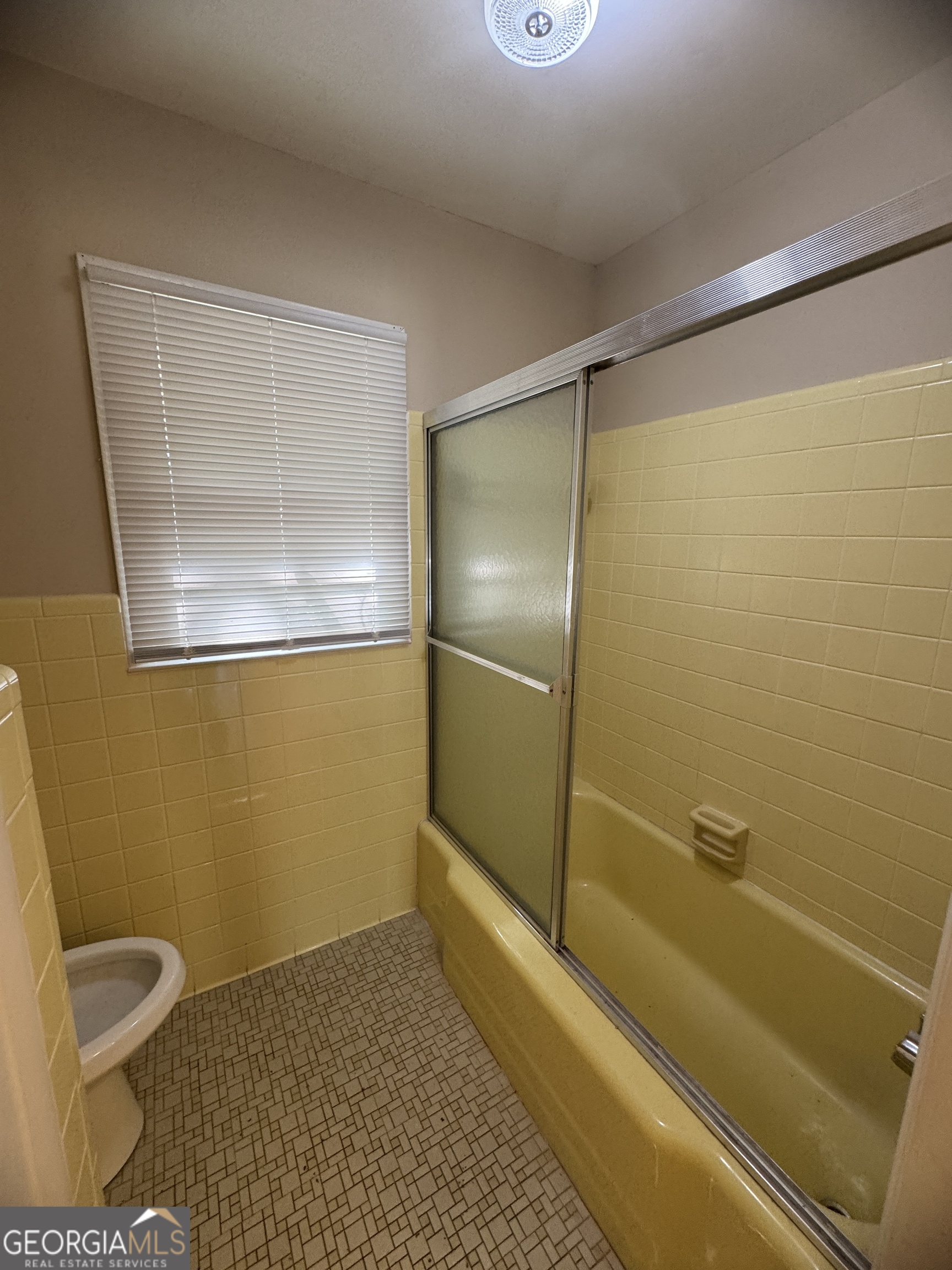 7290 Nevils Groveland Road Pembroke, GA 31321 - Photo 38 of 45 a bathroom with a shower and a toilet