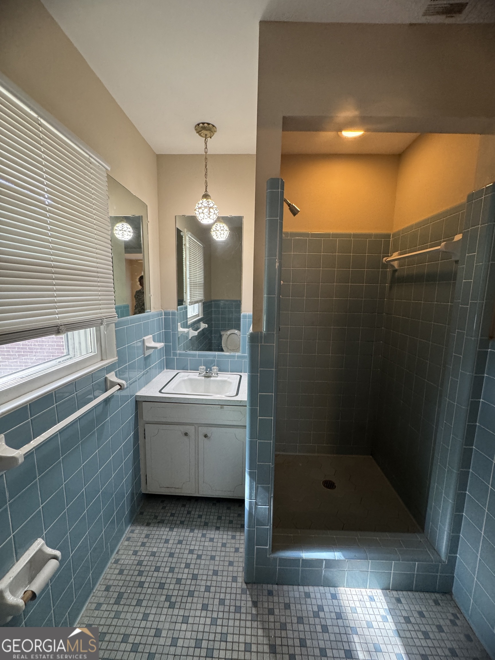 7290 Nevils Groveland Road Pembroke, GA 31321 - Photo 45 of 45 a bathroom with a granite countertop sink a toilet and shower