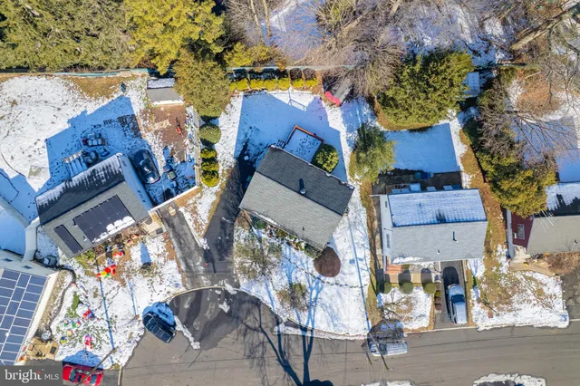 an aerial view of multiple houses with yard