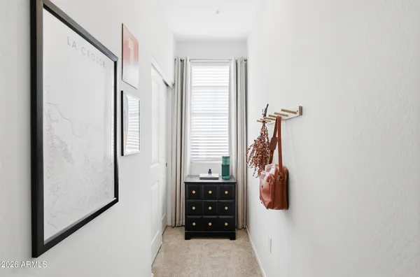 a view of walk in closet with clothes