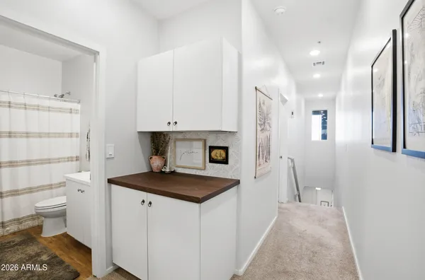 a kitchen with a refrigerator and a sink