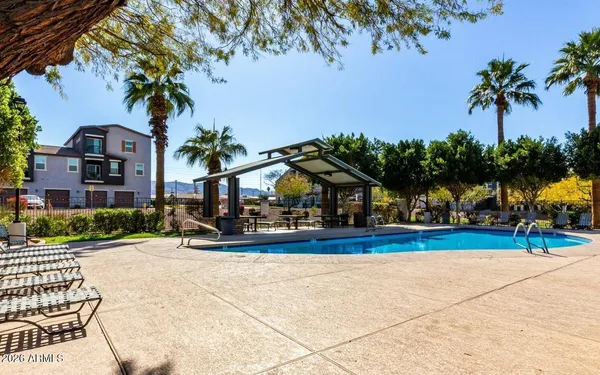 a view of a house with palm trees