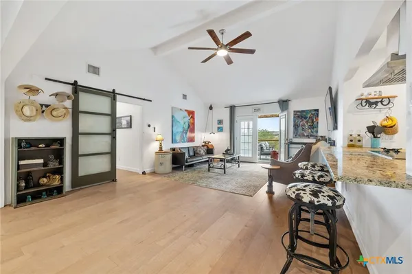 a living room with furniture and a rug