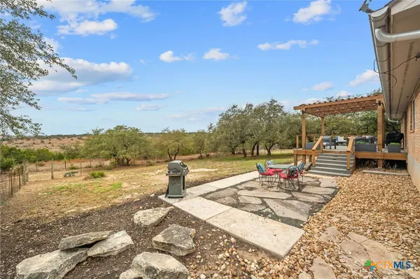 a view of a yard with a tree
