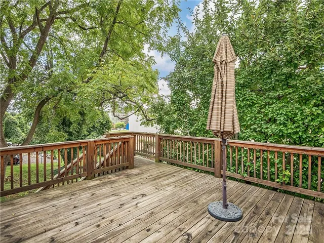 a view of deck with a wooden floor and fence