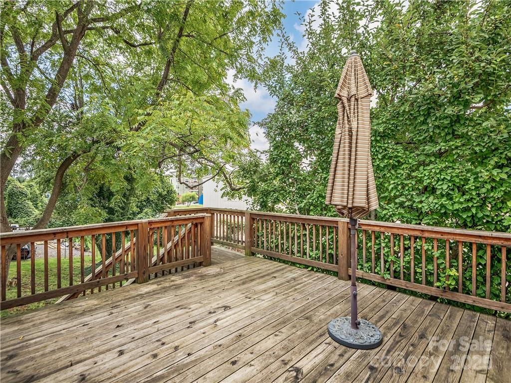21 Pearl Street Asheville, NC 28801 - Photo 11 of 26 a view of deck with a wooden floor and fence