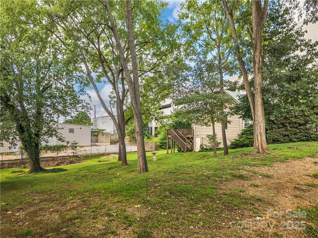 21 Pearl Street Asheville, NC 28801 - Photo 15 of 26 a view of a trees in a yard with tree s