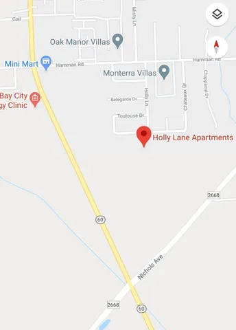 a view of wooden floor with a black white wall