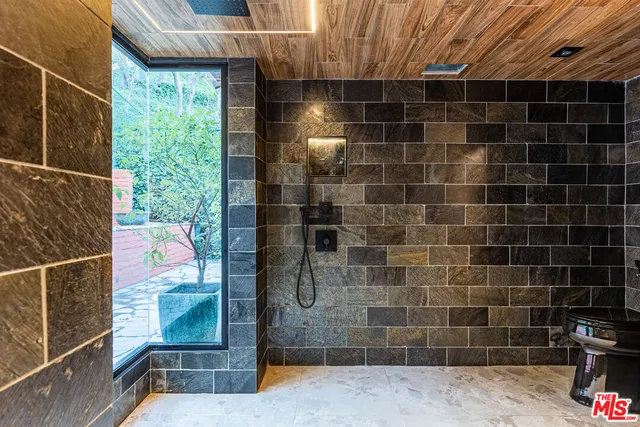 a living room with furniture a ceiling fan and a rug