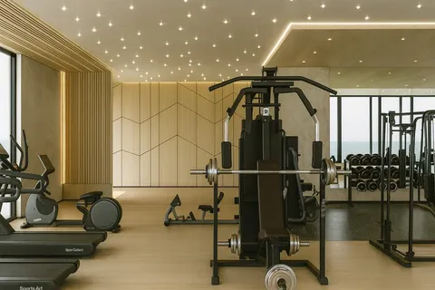 a room with gym equipment and glass door