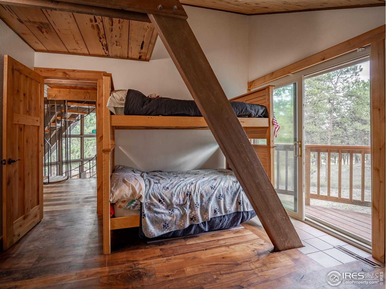 208 Wild Tiger Road Boulder, CO 80302 - Photo 25 of 42 upper level bedroom with private deck
