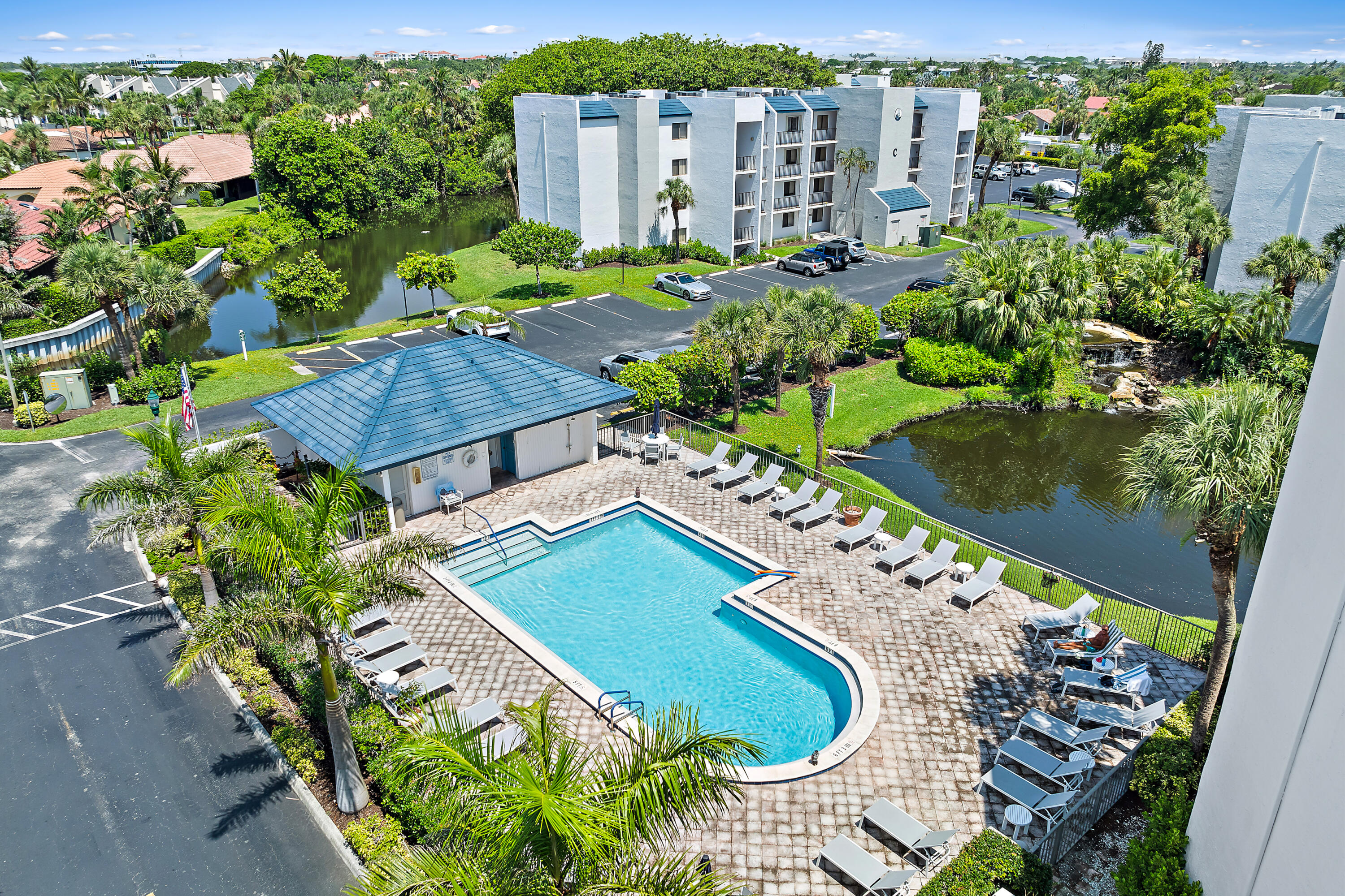 1605 Highway 1, Unit E203 Jupiter, FL 33477 - Photo 1 of 28 an aerial view of a house with a garden and lake view