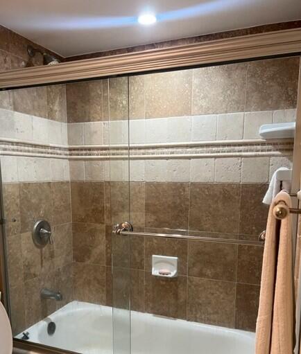 1605 Highway 1, Unit E203 Jupiter, FL 33477 - Photo 20 of 28 a bathroom with a shower