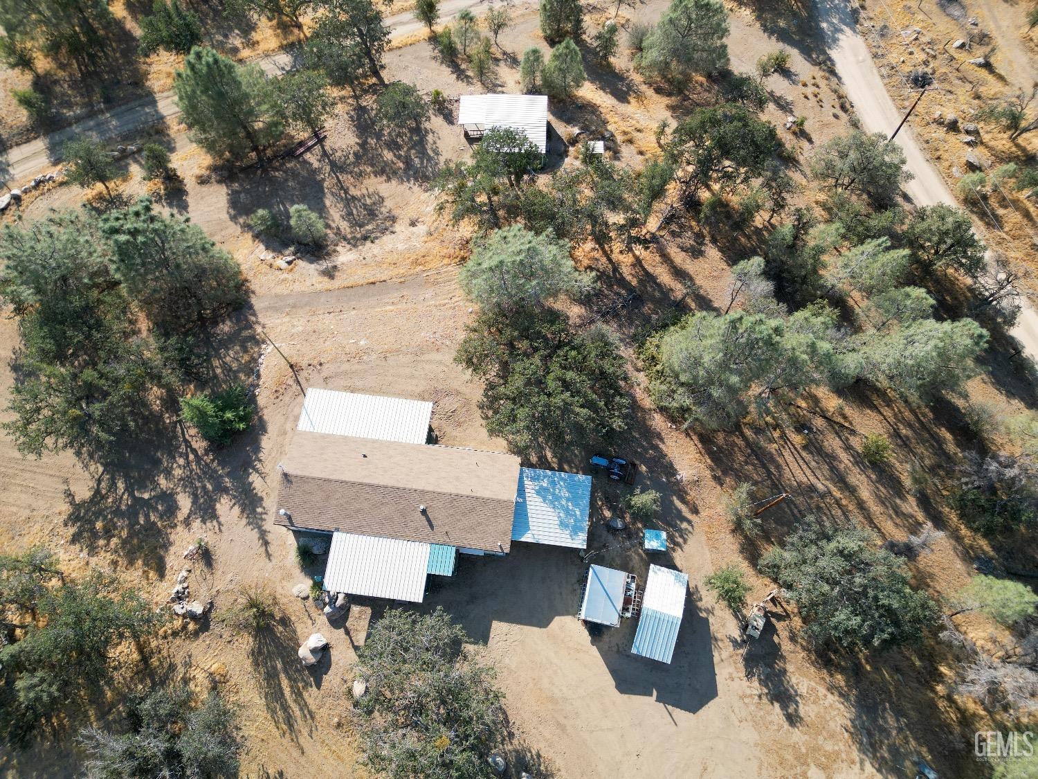 Undisclosed Address Caliente, CA 93518 - Photo 16 of 37 an aerial view of a house with a yard
