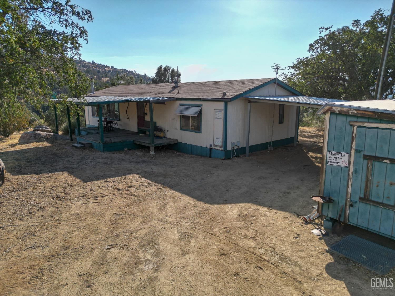 Undisclosed Address Caliente, CA 93518 - Photo 27 of 37 a front view of a house with a yard
