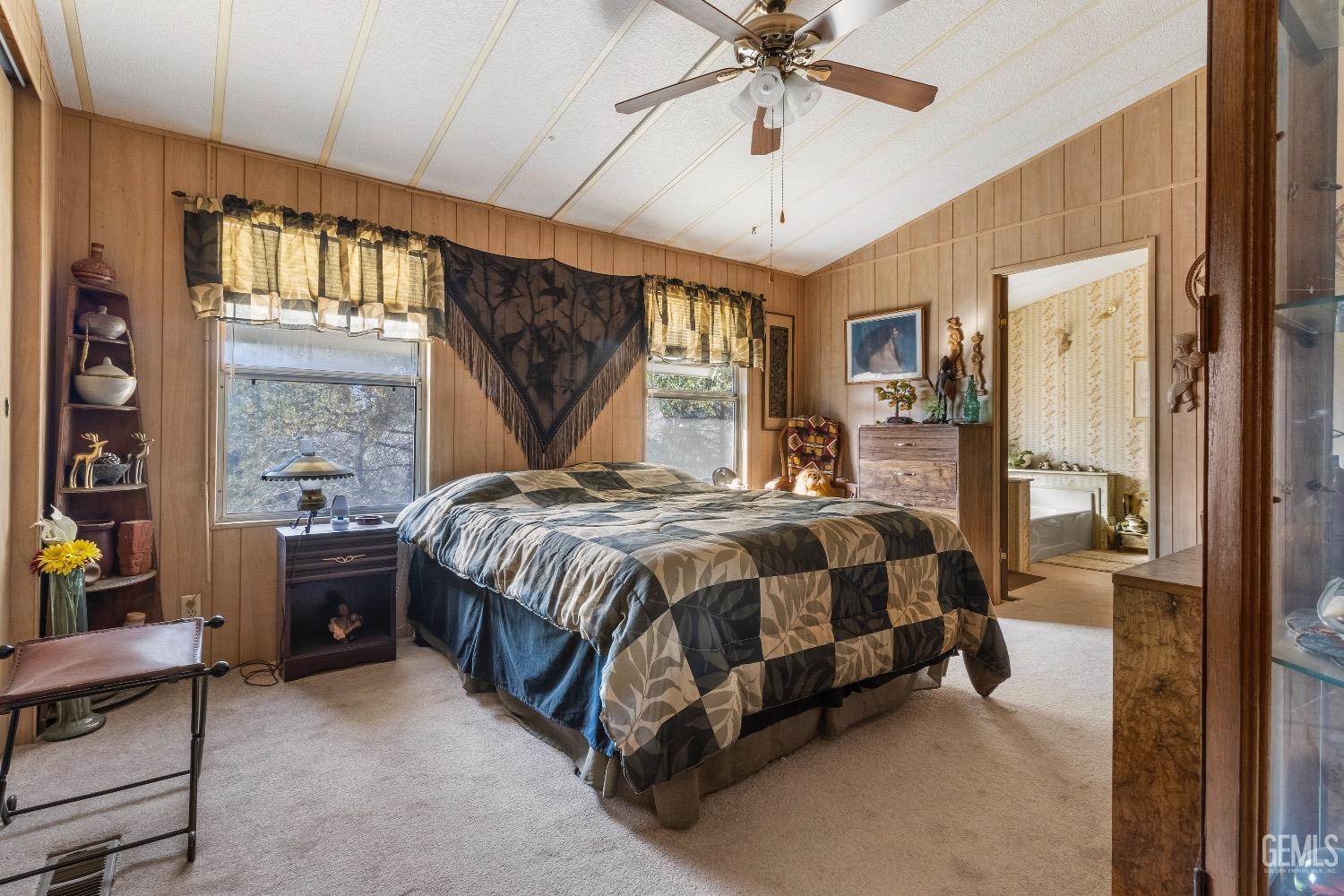 Undisclosed Address Caliente, CA 93518 - Photo 36 of 37 a spacious bedroom with a bed and a chandelier