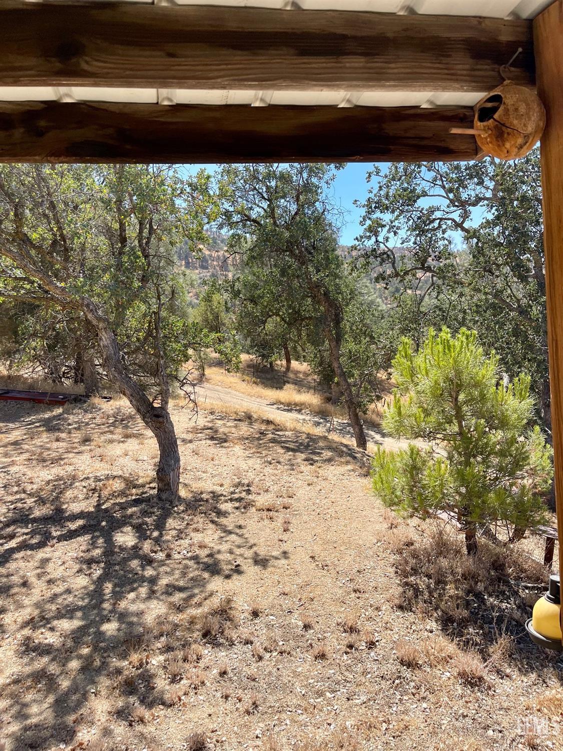 Undisclosed Address Caliente, CA 93518 - Photo 10 of 37 a view of a backyard of a house with a yard