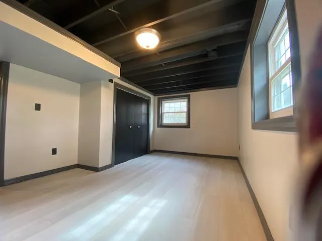 a view of an empty room with a window