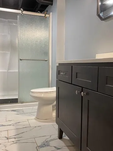 a bathroom with a sink double vanity and a mirror