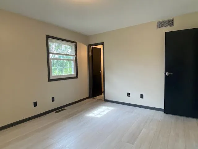a bathroom with a double vanity sink and mirror